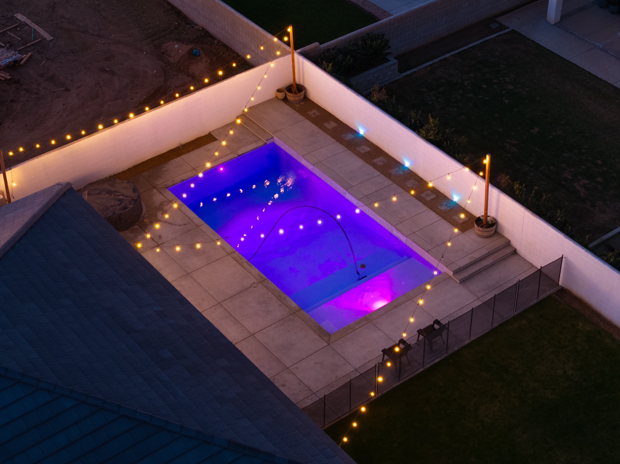 Aerial view of custom gunite pool with LED lighting at night — Bakersfield, CA