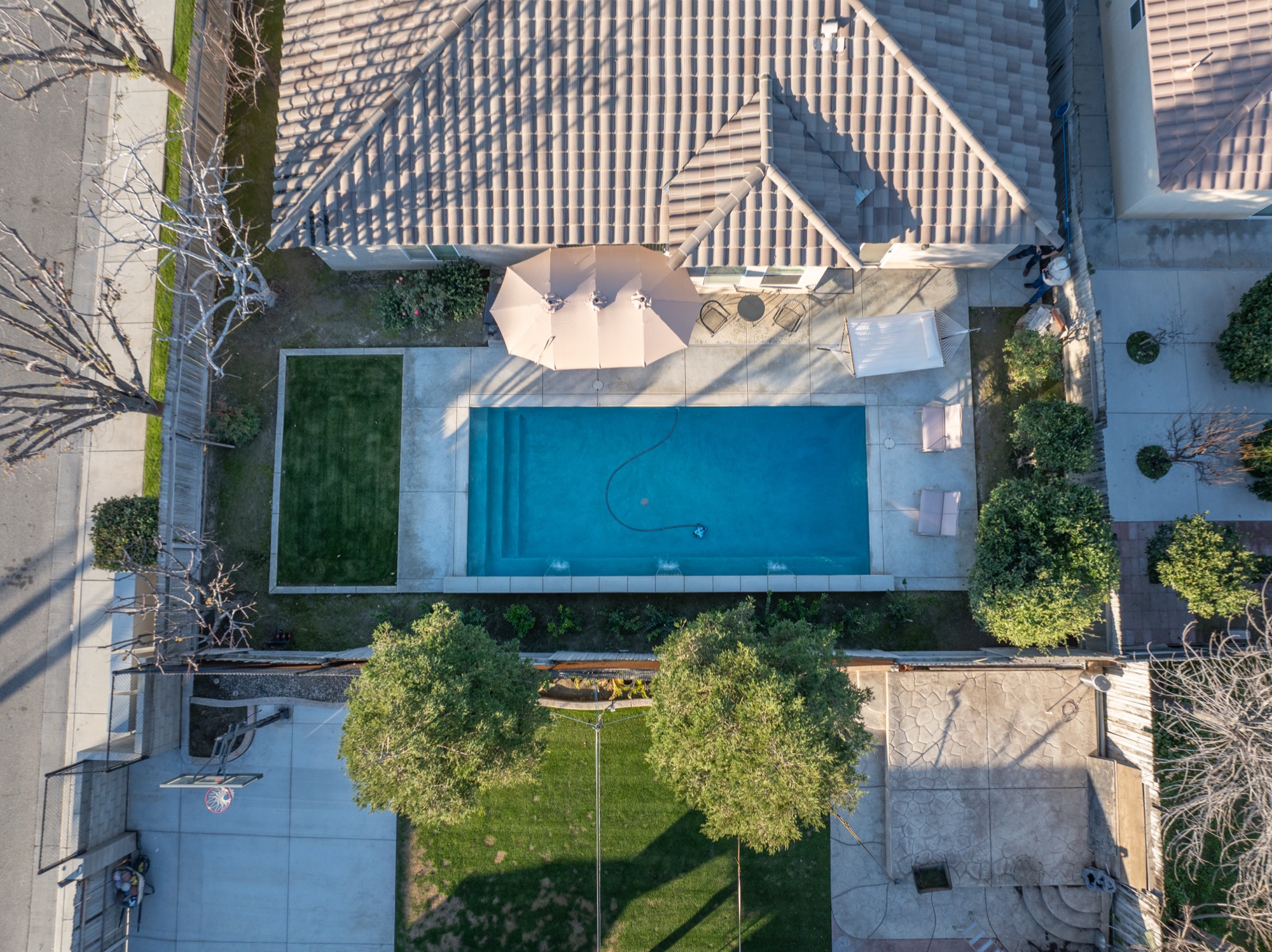 Aerial view of custom gunite pool in a residential backyard