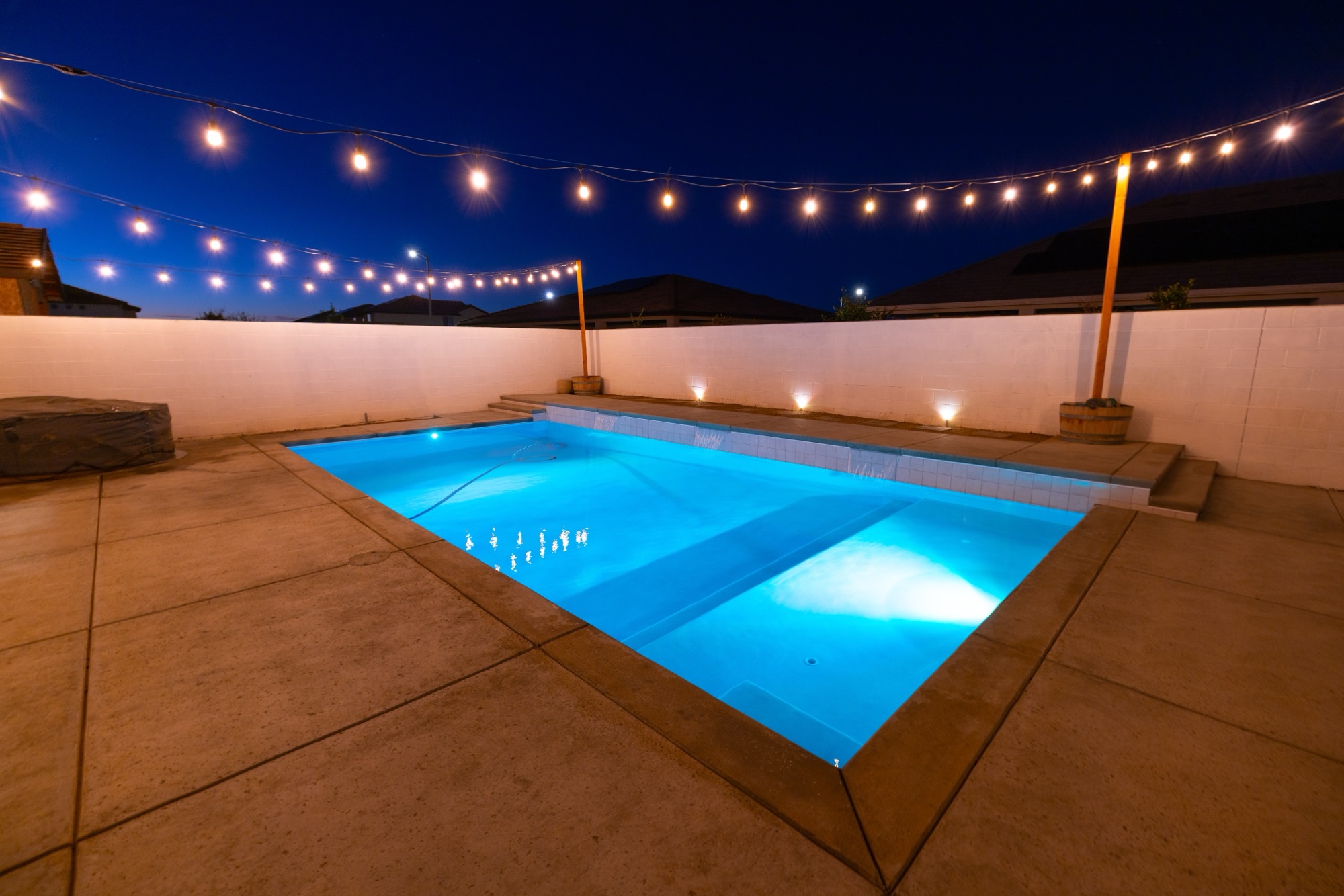 Custom gunite pool at night — Bakersfield, CA