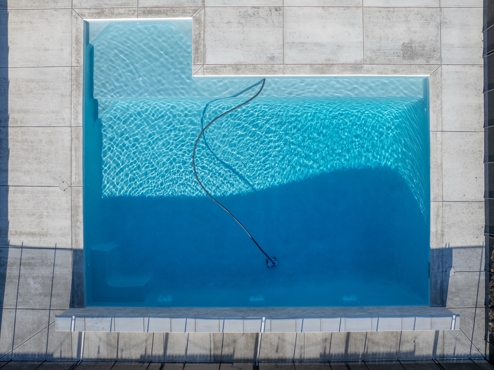 Overhead aerial view of a completed custom gunite pool