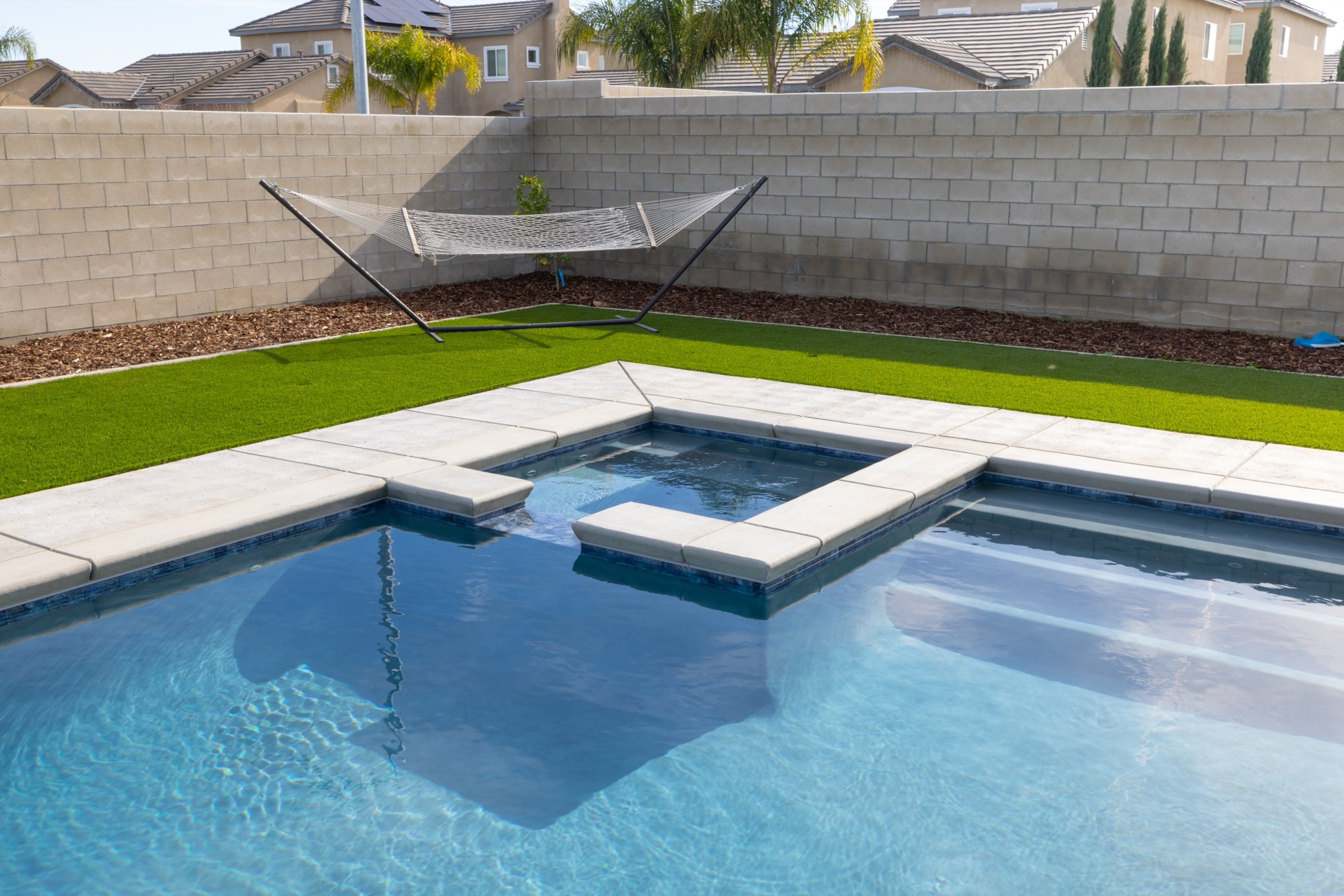 Custom gunite pool with spa, hammock, and turf yard — Bakersfield, CA